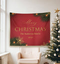 Decorative Christmas banner with personalized text hanging on a wall next to a Christmas tree.