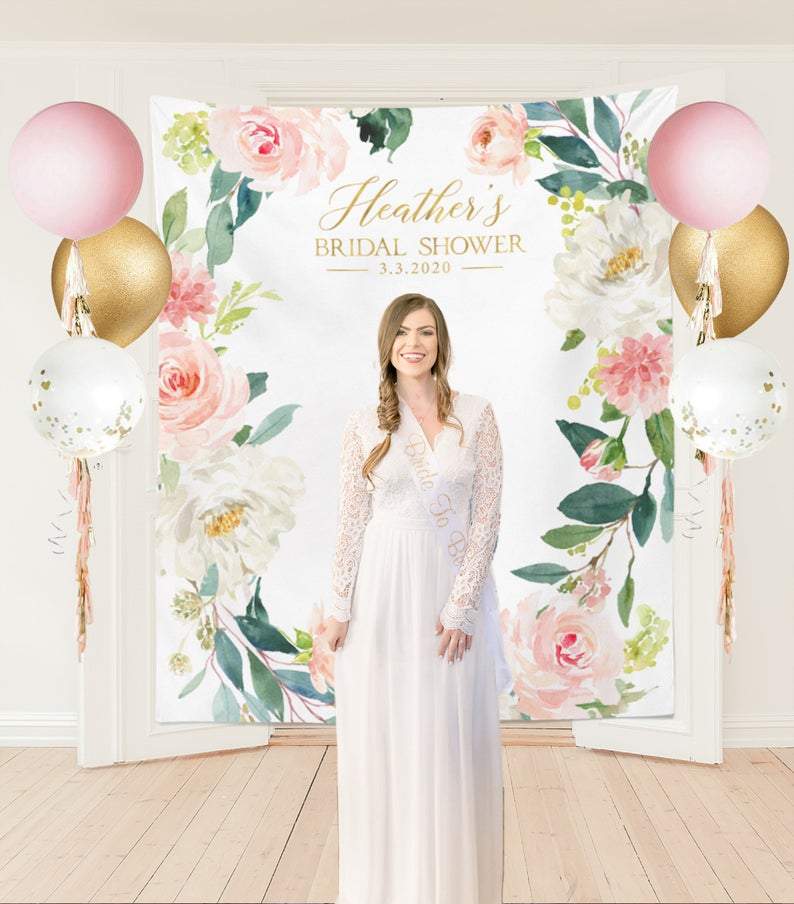 Floral Bridal Shower backdrop with bride to be